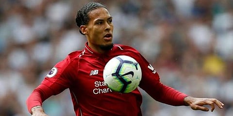 Andrew Robertson defender Virgil van Dijk (Photo | AFP)