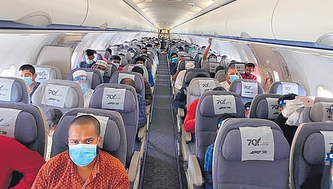 Employees of Expertise Contracting Company on board a repatriation flight