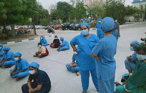 Nurses at Omandurar Government Hospital stage a protest over alleged shortage of staff to attend to COVID-19 patients in Chennai. (Photo | PTI)