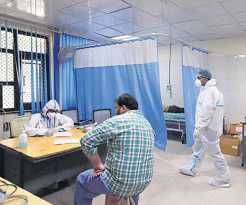 Medical workers in PPE kit at the Flu Centre at Aruna Asif Ali Hospital. (Photo | EPS)