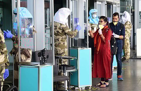 A CISF personnel checks the ID of a passenger. (Photo | Vinod Kumar T, EPS)