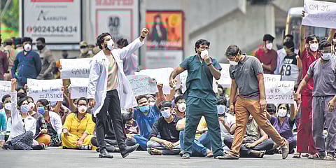 PG doctors block a road near Gandhi Hospital in Hyderabad on Wednesday as they protest the violence against healthcare workers | Vinay Madapu
