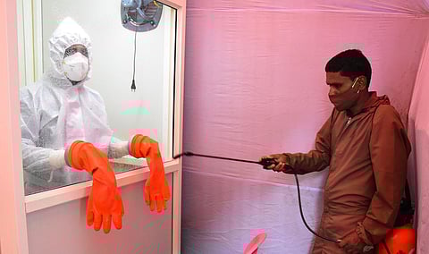 A man sanitises a testing booth at Aipiri in Andhra Pradesh. (Photo|EPS/ Madhav K)