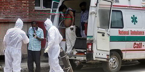 Health workers carry patient at LNJP hospital, in New Delhi (File photo| ANI)