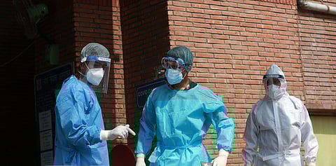 Medical professionals wearing PPE coveralls seen outside the Covid-19 ward at LNJP Hospital in New Delhi. (Photo | Shekhar Yadav, EPS)