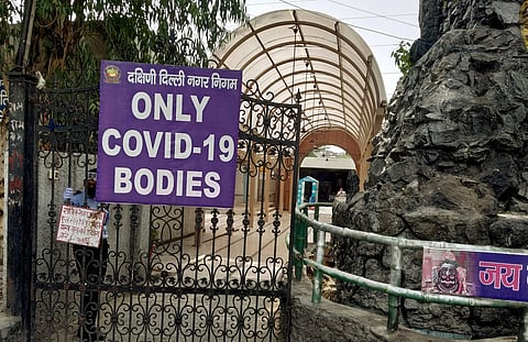 A notice board restricts bodies for cremation to that of COVID-19 victims at the Punjabi Bagh crematorium during the ongoing nationwide lockdown in New Delhi Friday June 12 2020. (Photo | PTI)