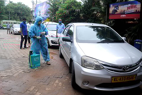 A long queue of Ola Cab cars near the Cheranalloor petrol pump for disinfection of the vehicle and the thermal scanning of the drivers. The vehicles are required to undergo the disinfection after every 48 hours of ride. (Photo | A Sanesh/EPS)