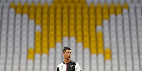 Cristiano Ronaldo stands in front of the empty stands. (Photo | AP)