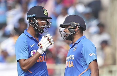 India's KL Rahul, left, interacts with batting partner Rohit Sharma after hitting a boundary. (Photo | AP)