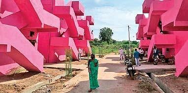 The newly-inaugurated 2BHK houses in Kamareddy district painted a bright pink, which is the TRS party’s colour