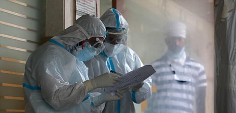 Medics collect samples of people for COVID-19 testing during the ongoing nationwide lockdown in New Delhi on Saturday. (Photo | Shekhar Yadav/EPS)