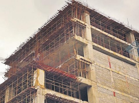 A building under construction remains deserted as the lack of workforce keeps delaying its progress