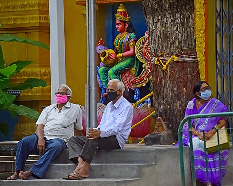 Gazing ahead, with the masks firmly in place. (Photo | EPS)