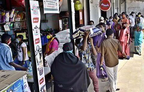 Local residents wait in que at a private supermarket to buy grosaries on EH road following the announcement of Lockdown that would come into force from 19th June in Chennai on Tuesday. (Photo | P Jawahar, EPS)