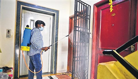 A corporation worker disinfecting an apartment in Chennai | DEBADATTA MALLICK