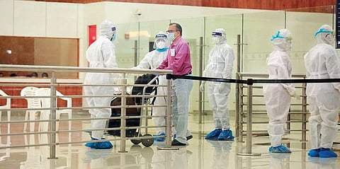 An expatriate who arrived from Abu Dhabi on an evacuation flight comes out of the Kochi airport | Express