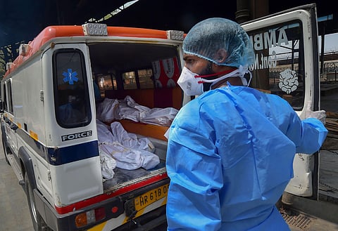 An ambulance carrying six deceased who succumbed to COVID-19 arrives from LNJP hospital at Nigambodh ghat for cremation during the ongoing nationwide lockdown in New Delhi Sunday June 14 2020. (Photo | PTI)