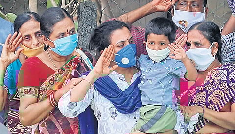 Col B Santosh Babu’s four-year-old son Anirudh and wife Santoshi salute as he is cremated at Kesaram village near Suryapet