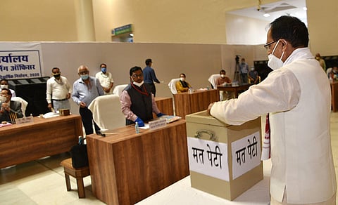 Madhya Pradesh Chief Minister Shivraj Singh Chouhan casts his vote for Rajya Sabha elections in the State Assembly in Bhopal Friday June 19 2020. (Photo | PTI)