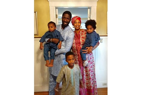 This 2019 photo shows Bouba Diemé with his wife, Désirée Allen, their 5-year-old son, Buraq Abdou, center, and twin 1-year-olds, Sembène Khalifa, held by Diemé, and Sankara Kokà. Diemé said the family’s isolation during lockdown due to the coronavirus pan