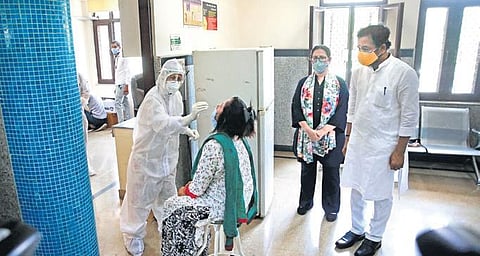 MoS Home G Krishna Reddy and BJP MP Meenakshi Lekhi at a Covid screening centre on the first day of rapid testing method at Vasant Gaon. (Photo | Shekhar Yadav, EPS)