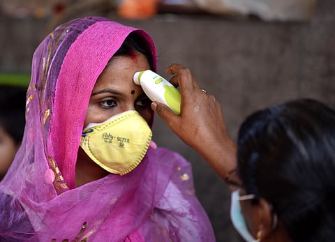 Thermal screening at Kapaleeswarar temple Mylapore before places of worship were shut down (Photo | R Satish Babu/EPS)