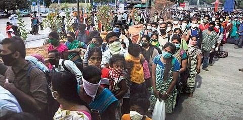 Passengers wait outside Vijayawada railway station to board Guntur-Secunderabad train on Monday | PRASANT MADUGULA