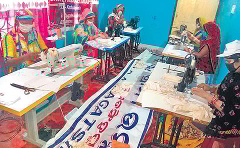 Members of a self help group engaged in stitching masks. (Photo| EPS)