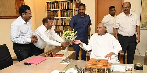 Hotel and Restaurant Association of Odisha chairman JK Mohanty greets Odisha CM Naveen Patnaik. (File photo)
