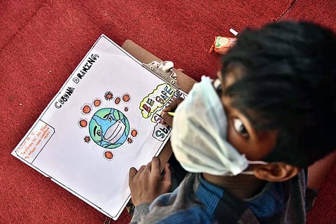 A child competes in a drawing competition on COVID-19 in Chennai. (Photo | P Jawahar/EPS)