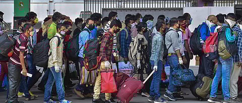 Migrants step out of railway station after arriving via Shramik Special to reach their native places, during the ongoing COVID-19 nationwide lockdown. (Photo | PTI)