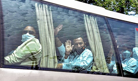 Congress MLAs board a bus towards State Assembly to cast their vote for Rajya Sabha elections in Bhopal Friday June 19 2020. (Photo | PTI)