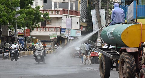 A worker disinfecting Sunnam Battela Centre in Vijayawada on Sunday I P Ravindra Babu