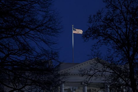 The US flag flying over the White House. (Photo | AFP)