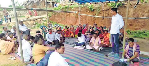 The villagers sitting on indefinite dharna near Handapa railway station. (Photo |EPS)