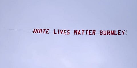 Plane pulling ‘white lives matter’ banner flies above Etihad Stadium. (Photo | AP)
