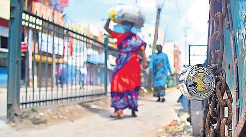 It was shutters down for shops in Bengaluru’s KR Market on Tuesday, after positive cases were reported from the area | pandarinath b