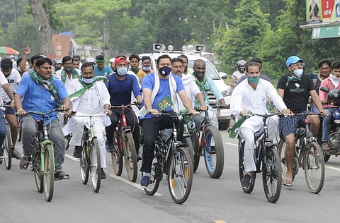 Tejashwi Yadav with his supporters during the cycle rally (Photo | EPS)