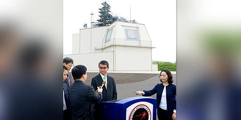 In this Jan. 13, 2020, photo, Japanese Defense Minister Taro Kono, center, speaks to reporters on the Hawaiian island of Kauai after inspecting an Aegis Ashore missile-defense system at the Pacific Missile Range Facility of the U.S. Navy. (Photo | AP)
