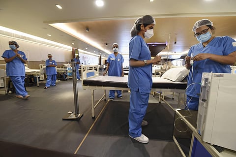 Medics set up equipments inside the newly modified isolation ward at Shehnai Banquet Hall opposite the LNJP Hospital to take care of COVID-19 patients in New Delhi Thursday June 25 2020. (Photo | PTI)