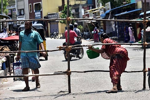 Local residents of Vyasarapadi area seen crossing barricades put up to prevent movement during lockdown in Chennai. (Photo | P Jawahar, EPS)