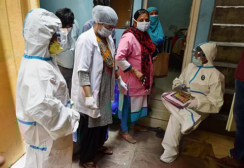 Medics interact with residents during a serological survey to analyse the spread of COVID-19 at Paharganj in New Delhi Saturday June 27 2020. (Photo | PTI)