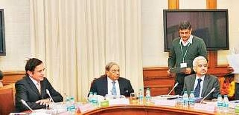 The chairman of Finance Commission, N K Singh (C) with the members at a meeting in New Delhi. (File Photo)