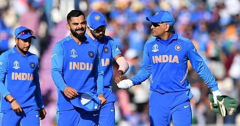 India's captain Virat Kohli (2L) with Mahendra Singh Dhoni (R). (Photo | AFP)