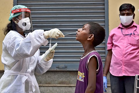 Swab test being done for COVID-19 on slum children at Sowcarpet, Chennai. (Photo | P Jawahar, EPS)