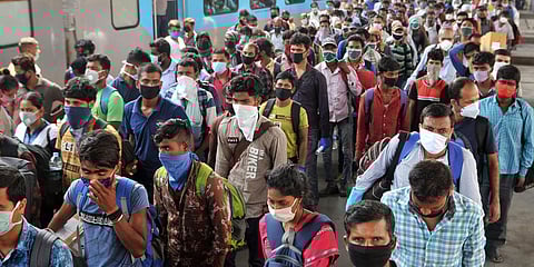 Migrants, who were stranded in Bhubaneswar, arrive at Howrah station during the nationwide lockdown amid COVID-19 pandemic. (FIle photo| ANI)