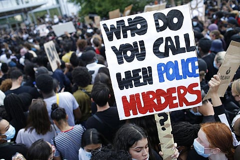 Protesters gather in front of the Paris courthouse. (Photo | AP)