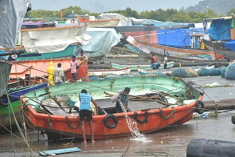 Fishermen secure their boat as they move to a safer place after Cyclone Nisarga made landfall at Uttam in Thane. (Photo | PTI)