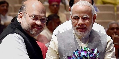 PM Narendra Modi (R) with Union Home Minister Amit Shah (Photo | PTI)