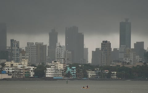 Fishermen row their boat at Mahim during rain in the aftermath of cyclone Nisarga in Mumbai Thursday June 4 2020. (Photo | PTI)